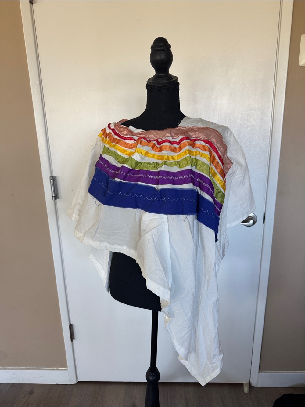 Hand Crafted White Poncho with Rainbow Ribbon Yoke